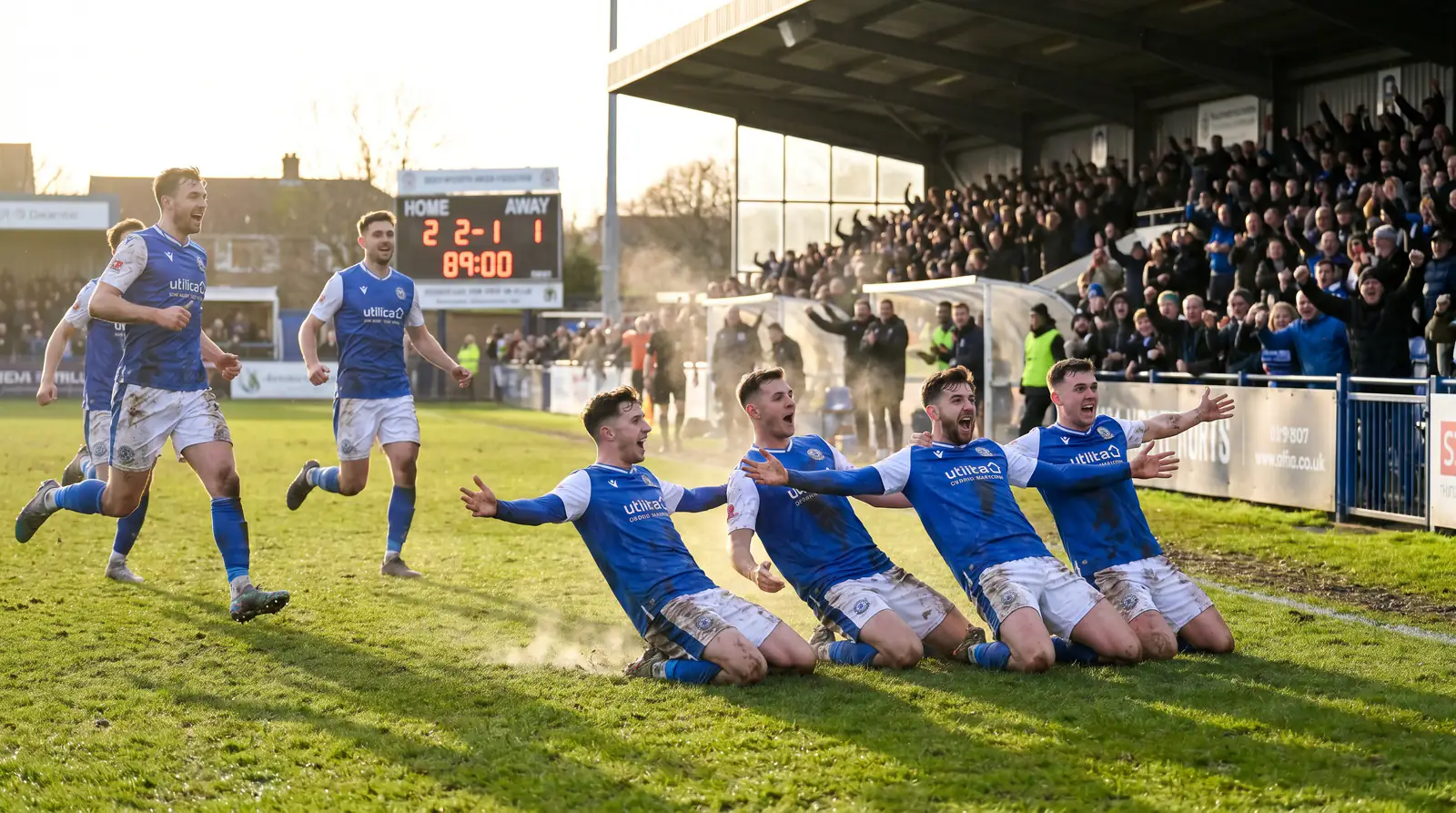 Championship football match with a newly promoted team celebrating an unexpected goal